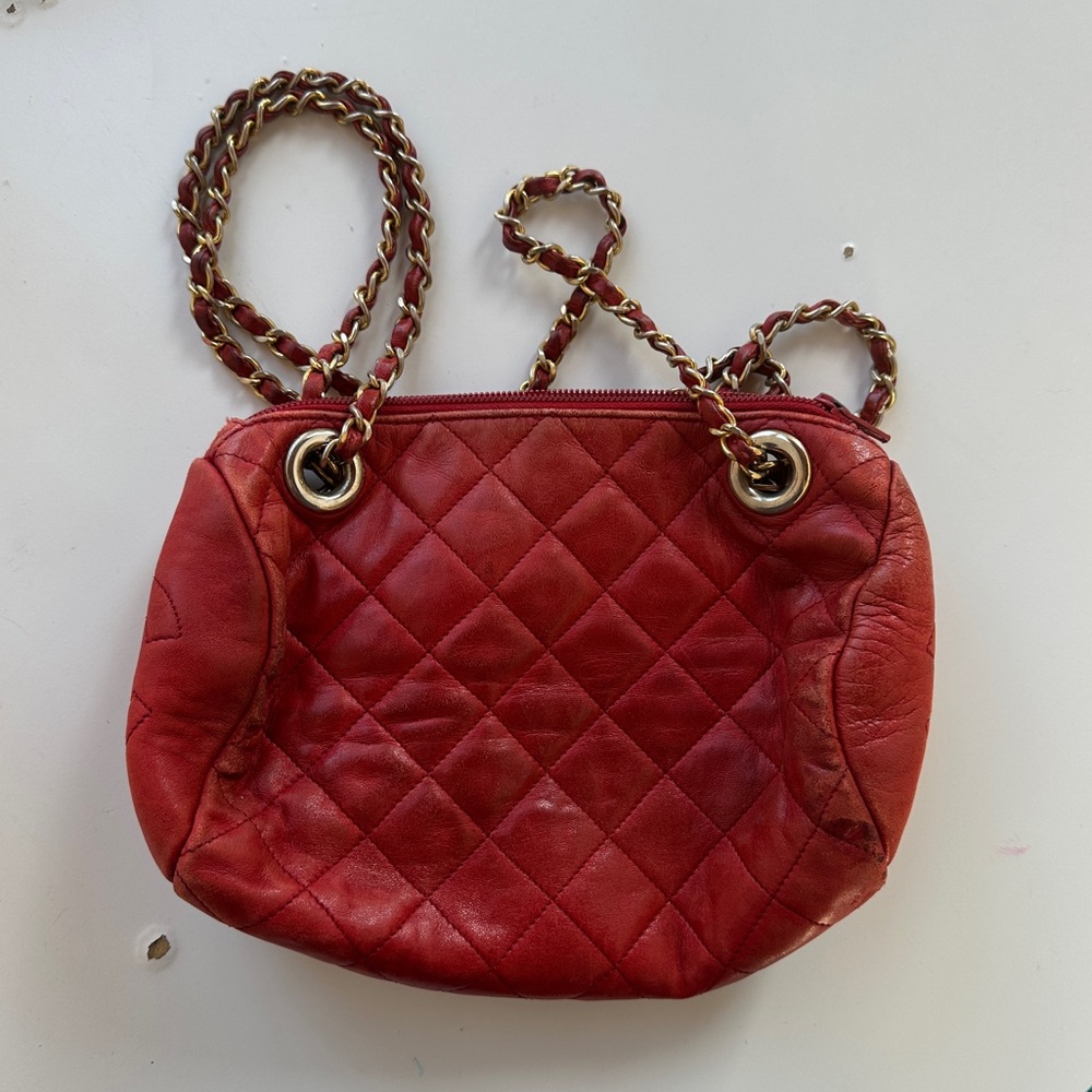 Red quilted barrel bag